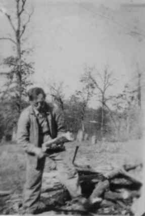 Benjamin Holt cutting wood
